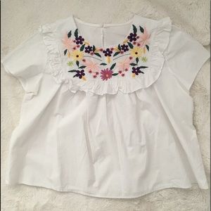 White peplum embroidered neck